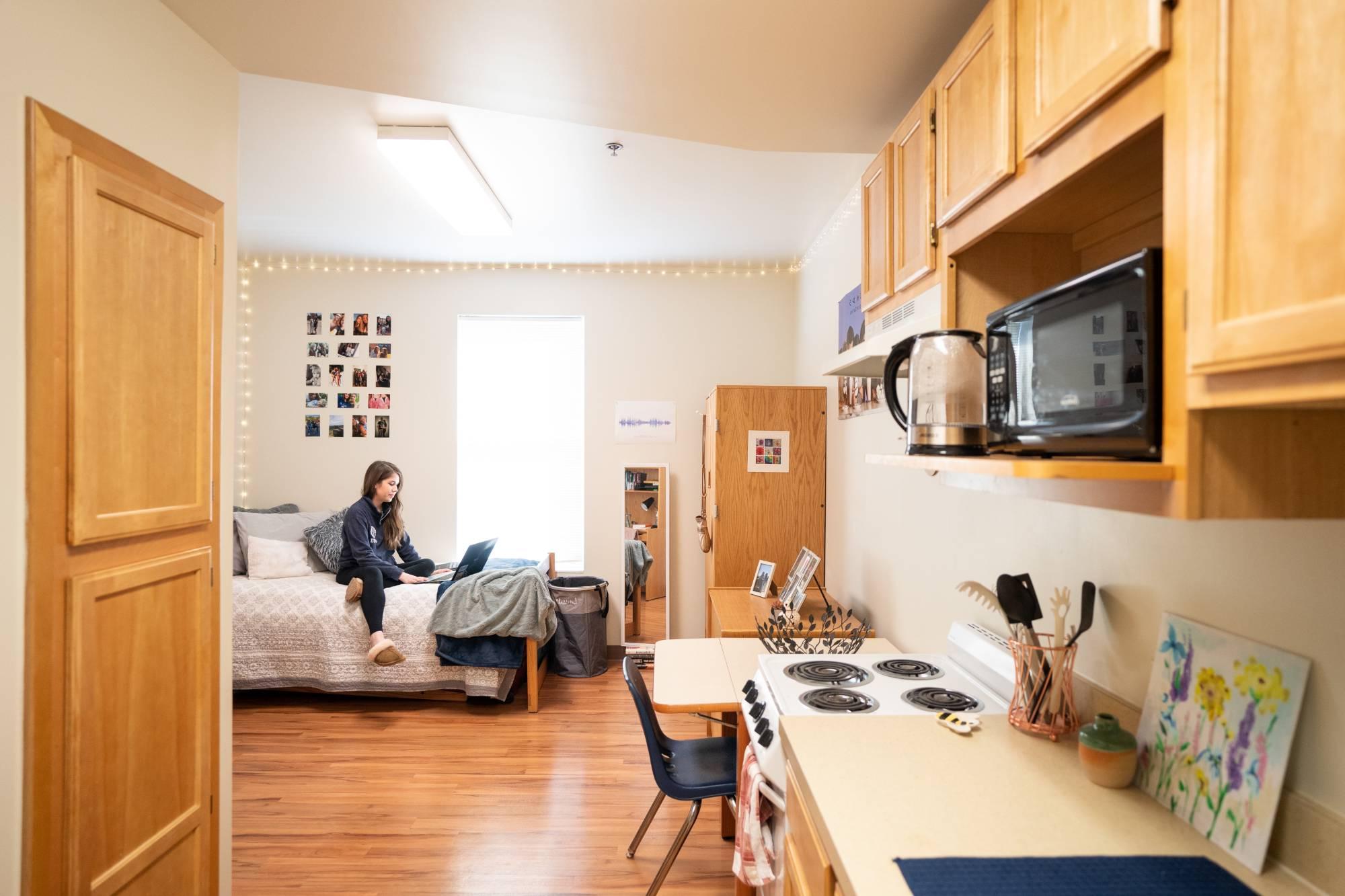 GVSU student studying in an on-campus apartment in Grand Rapids.